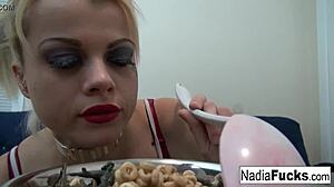 Horny blonde Nadia enjoys cereal with soldiers